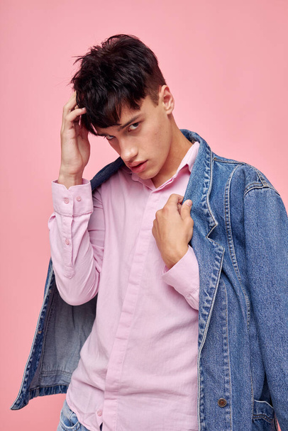 pretty man self confidence fashion clothing studio pink background unaltered - Foto, imagen