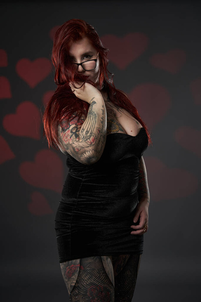 Beautiful size plus woman with tattoos in black mini dress, inclusiveness and body acceptance - Photo, Image