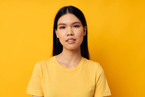 pretty asian woman in yellow t-shirt monochrome photo - Photo, Image
