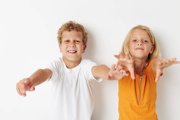 Portrait of cute children hand gestures fun childhood lifestyle unaltered - Foto, afbeelding