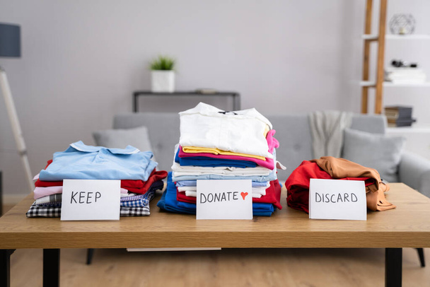 Declutter Clothes Wardrobe. Keep And Donate Fashion - 写真・画像