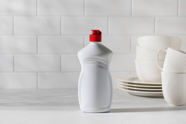 A mockup of a white plastic bottle with liquid dishwashing detergent. Banner. Copy space. - Fotoğraf, Görsel