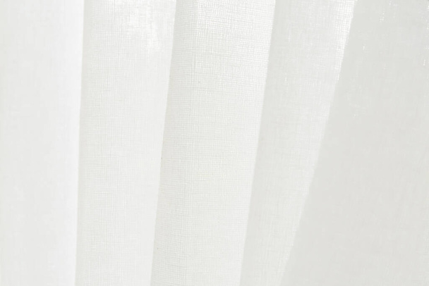 Close up white linen curtain background texture hanging by the window. - Photo, Image