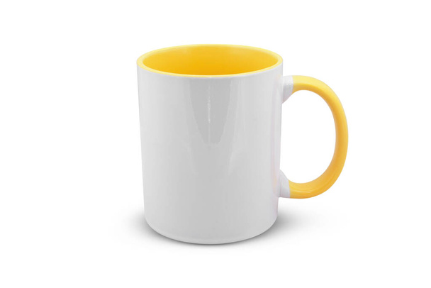 white mug with a yellow handle isolated on white background - Valokuva, kuva