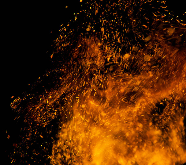 sparks of fire on a black background - Foto, imagen