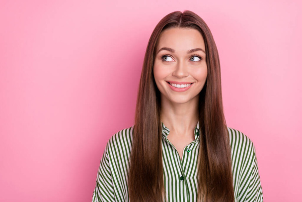 Photo of positive cute dreamy lady look empty space wear striped green shirt isolated pink color background. - Fotó, kép