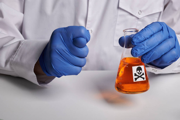 Doctor Shows Fig Gesture and Orange Poison Flask - Labs Photo - Fotó, kép