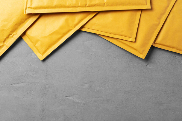 Lot of yellow paper postal envelopes. Top view. - Φωτογραφία, εικόνα