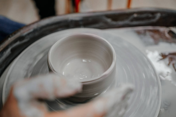 Modeling clay on a potter's wheel - Photo, Image