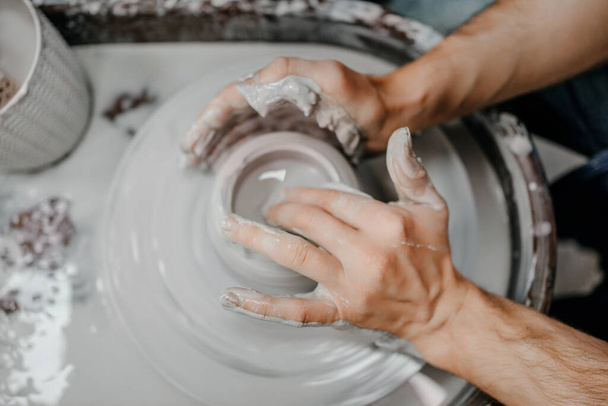 Modeling clay on a potter's wheel - Φωτογραφία, εικόνα