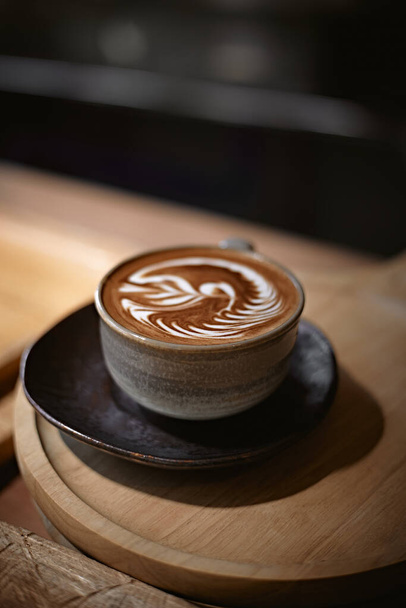 Selective focus cup of hot latte art coffee,focus at white foa - Foto, Bild