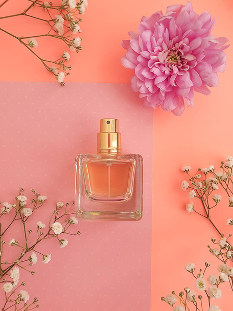 perfume bottle flower on colored background - Photo, Image