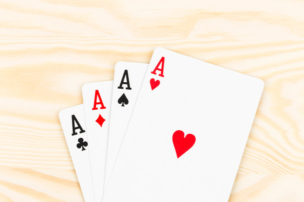 Four aces on wooden background - Photo, Image
