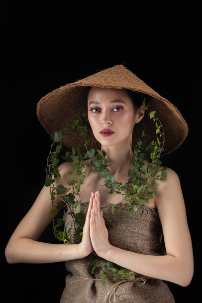 Beauty Spring or Woman with Fresh green leaves hat. Nature Girl portrait - Fotografie, Obrázek