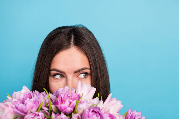 Cropped closeup image of adorable lady smell enjoy flowers scent look empty space dreaming isolated on blue color background - Foto, Imagem