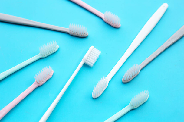 Toothbrushes on blue background. Top view - Photo, Image