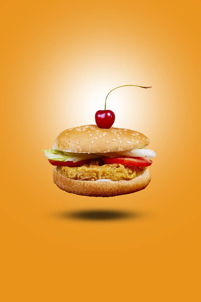 Juicy CHICKEN BURGER flying , hamburger or cheeseburger with one chicken patties. Concept of American fast food. Copy space - 写真・画像