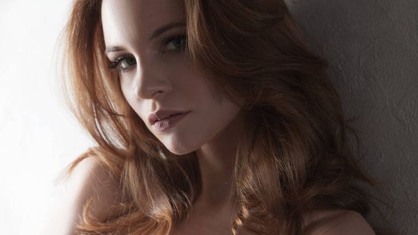 Attractive young red-haired woman, beautiful curls, e - Photo, Image