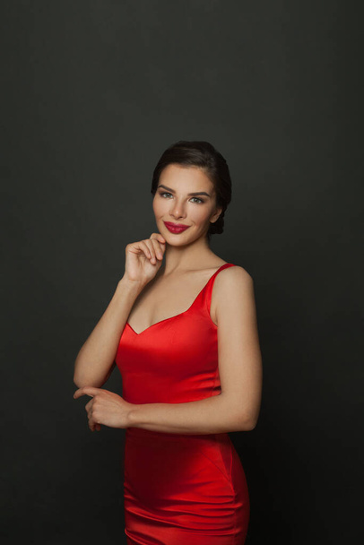 Pretty woman in red dress, people, holidays and fashion concept - Fotografie, Obrázek