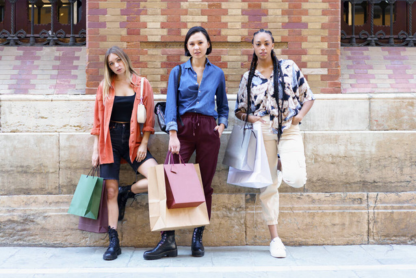 Trendy diverse women with shopping bags - Photo, Image