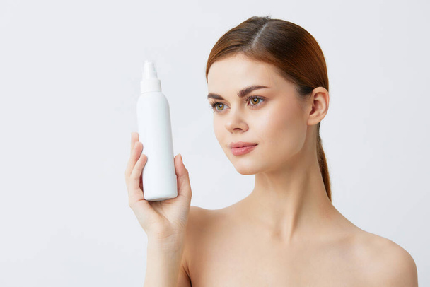 beautiful woman body lotion rejuvenation cosmetics light background - Photo, Image