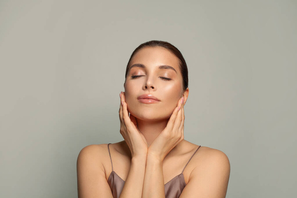 Attractive woman relaxing. Spa model with healthy skin and closed eyes - 写真・画像