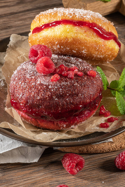 Bolas de Berlim, or "Berlin Balls". Portuguese fried dough with sugar, Filled with chocolate or raspberry jam. Portuguese fried dough with sugar. - Photo, Image