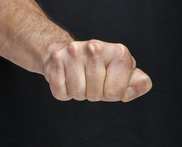 punch fist on a Black background - Foto, imagen