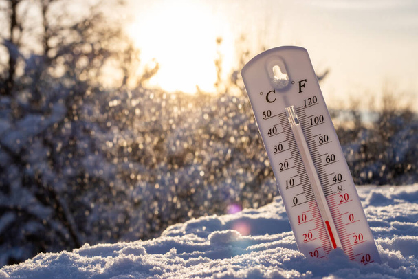 Thermometer in the snow. Extreme cold temperature at winter. - Photo, Image