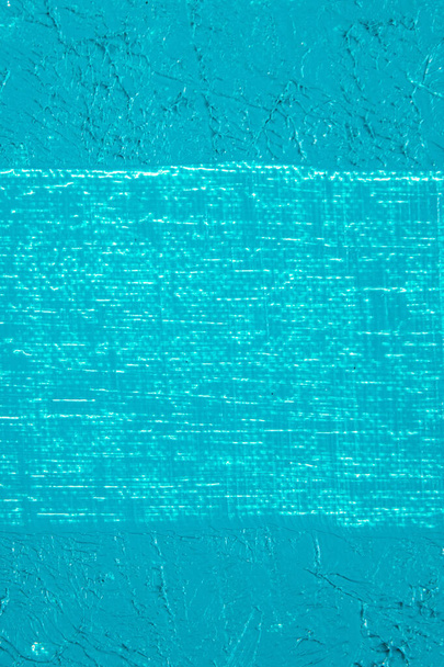 fondo turchese astratto, fondo tonificante applicato su una superficie bianca  - Foto, immagini
