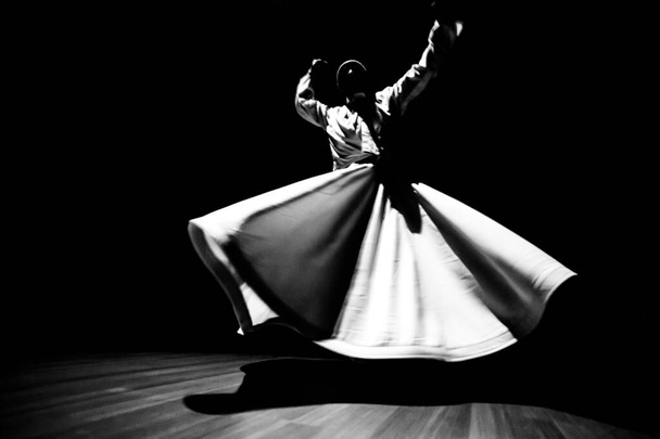 the image of a whirling Dervish in the darkness - Photo, Image