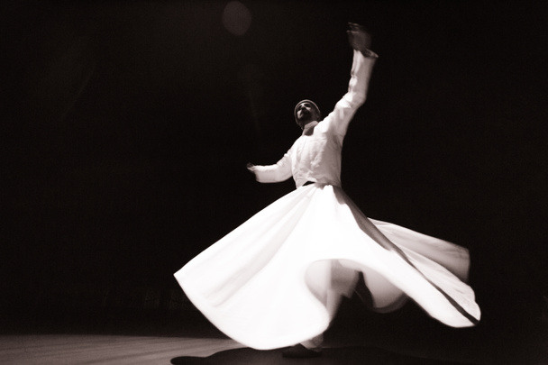 the image of a whirling Dervish in the darkness - Photo, Image