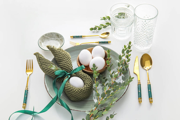 Stylish Easter table setting on white background - Photo, Image