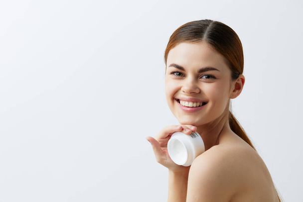 young woman jar of cream in hands clean skin posing close-up Lifestyle - Φωτογραφία, εικόνα