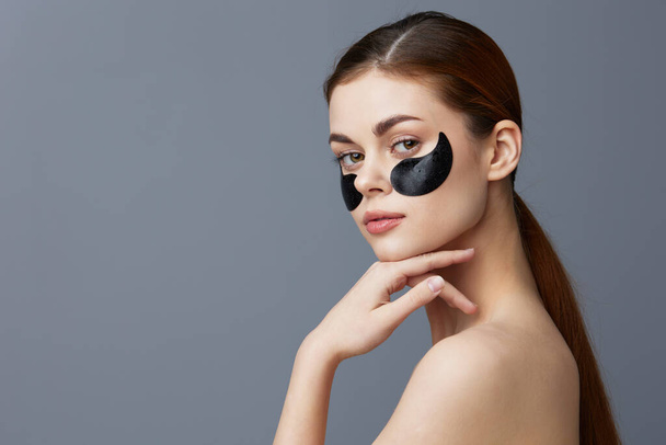 woman skin care anti wrinkle eye patches isolated background - Foto, Imagem
