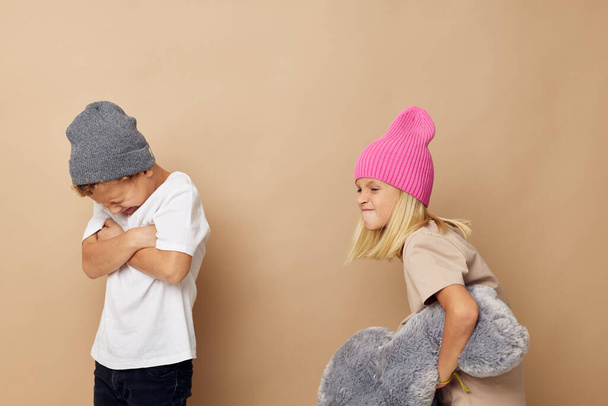Cute stylish children in hats with a teddy bear friendship Lifestyle unaltered - Φωτογραφία, εικόνα
