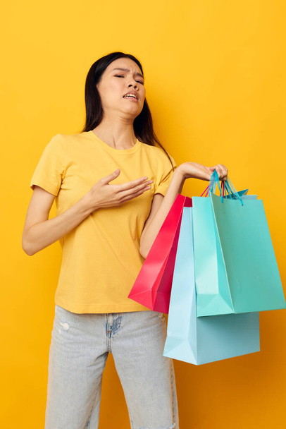 Portrait Asian beautiful young woman woman with packages in hands shopping Lifestyle unaltered - Foto, Imagem