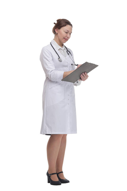 in full growth. female doctor with clipboard. - Foto, immagini