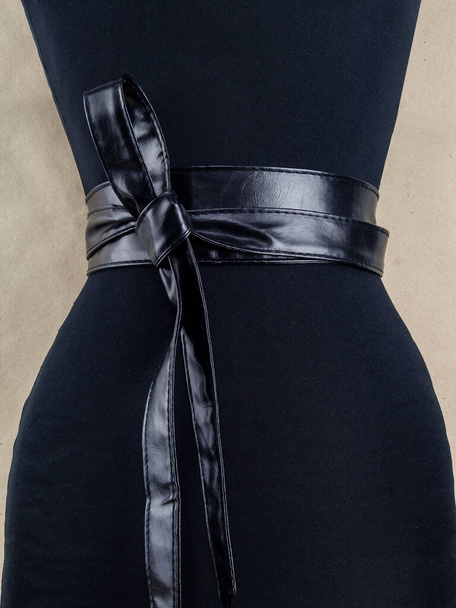 Belt on the woman's waist. The image and the option of tying. Image on a light background - Photo, Image