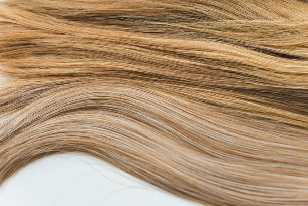 Wigs, natural and synthetic hair. Women's beauty concept. Close up photo of wig, hair for ladies - Photo, Image