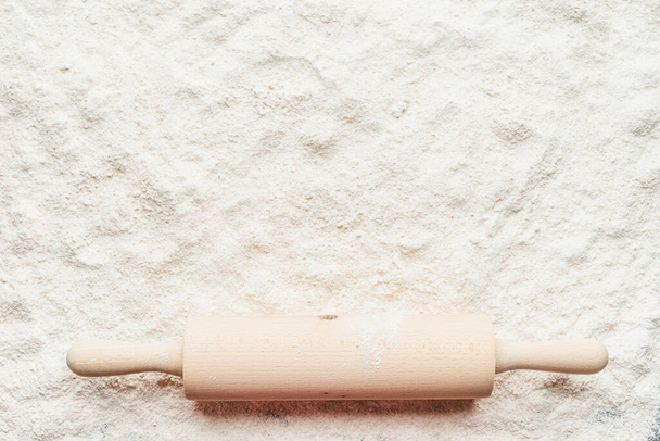 Flour and rolling pin, top view - Photo, image
