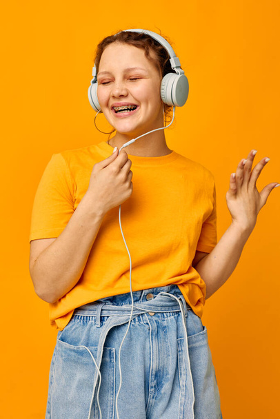beautiful woman summer style headphones dance isolated backgrounds unaltered - 写真・画像