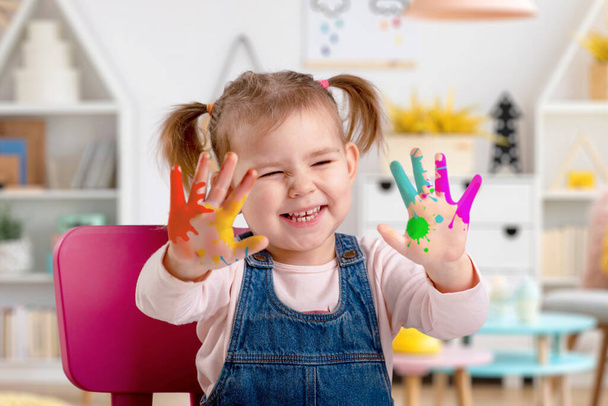 girl with paint on her hands - Photo, Image