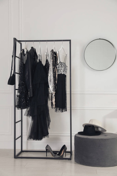 Stylish dressing room interior with trendy clothes, shoes and accessories - 写真・画像