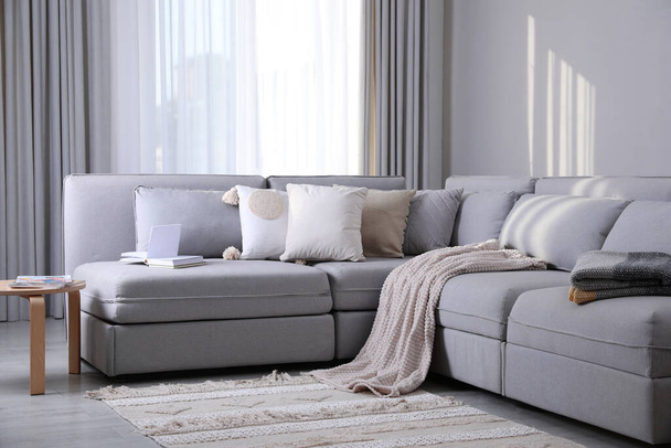 Living room interior with large grey sofa - Foto, immagini