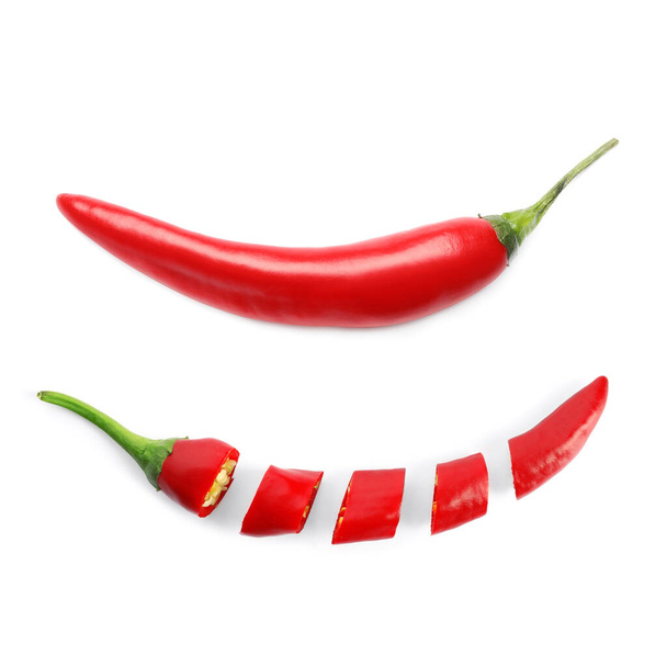 Cut and whole red hot chili peppers on white background - Foto, Imagen