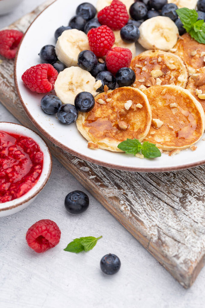 Keto diet pancakes made or almond flour, served with berries. - Photo, Image