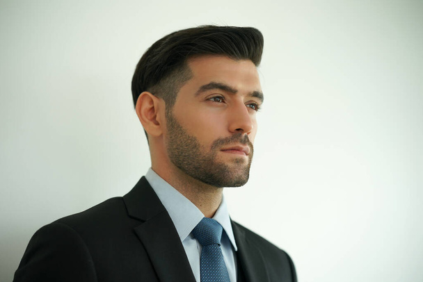 Elegant young Caucasian handsome man on White background, Studio fashion portrait. - Photo, Image