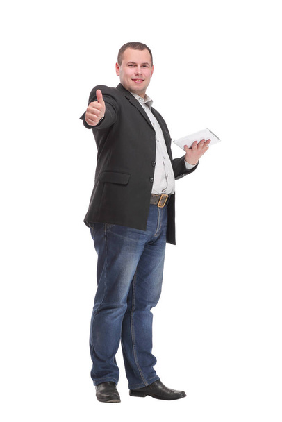 Young business man holding a tablet and showing thumb up while smiling to the camera. on white background - Fotoğraf, Görsel