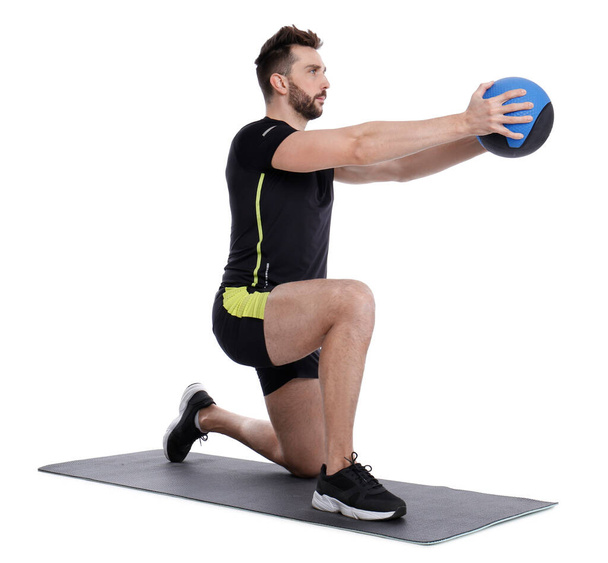Athletic man doing exercise with medicine ball isolated on white - Photo, image
